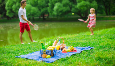 Happy family picnicking in the park