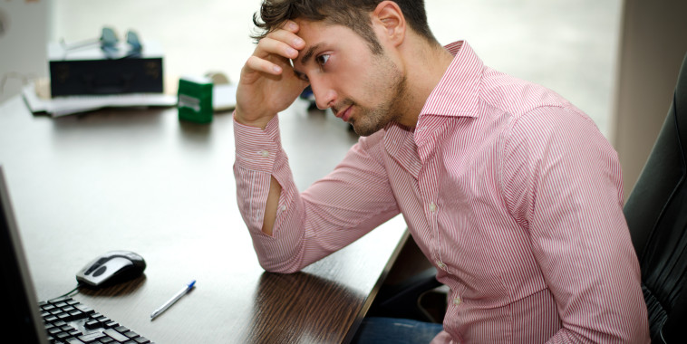 Stressed Man at Computer