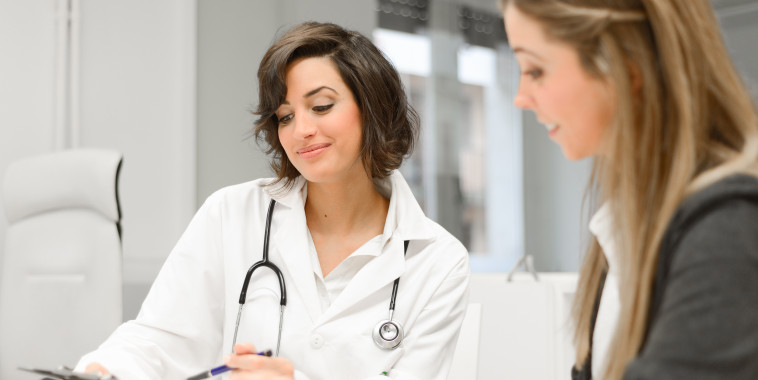 Doctor explaining diagnosis to her female patient