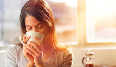 woman sipping a cup of tea