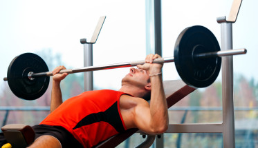 man lifting weights