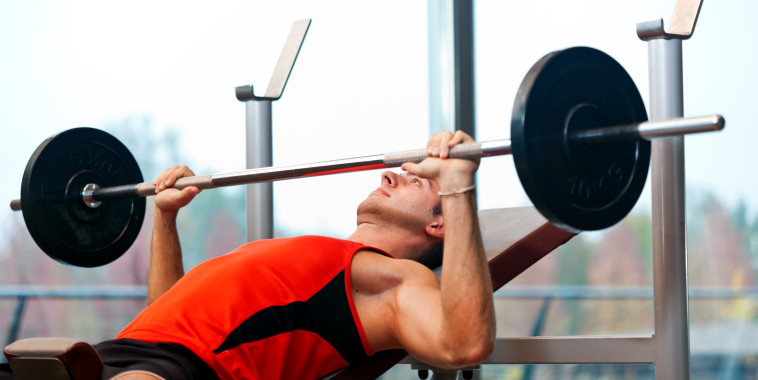 man lifting weights