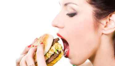 woman eating a hamburger