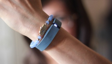 woman wearing a fitbit braclet