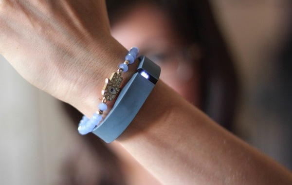 woman wearing a fitbit braclet