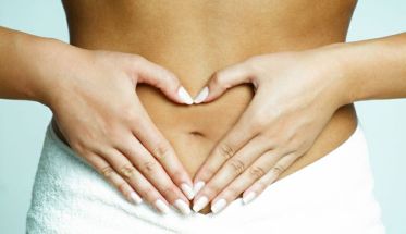 Woman's Fingers Touching her body parts, heart shaped fingers