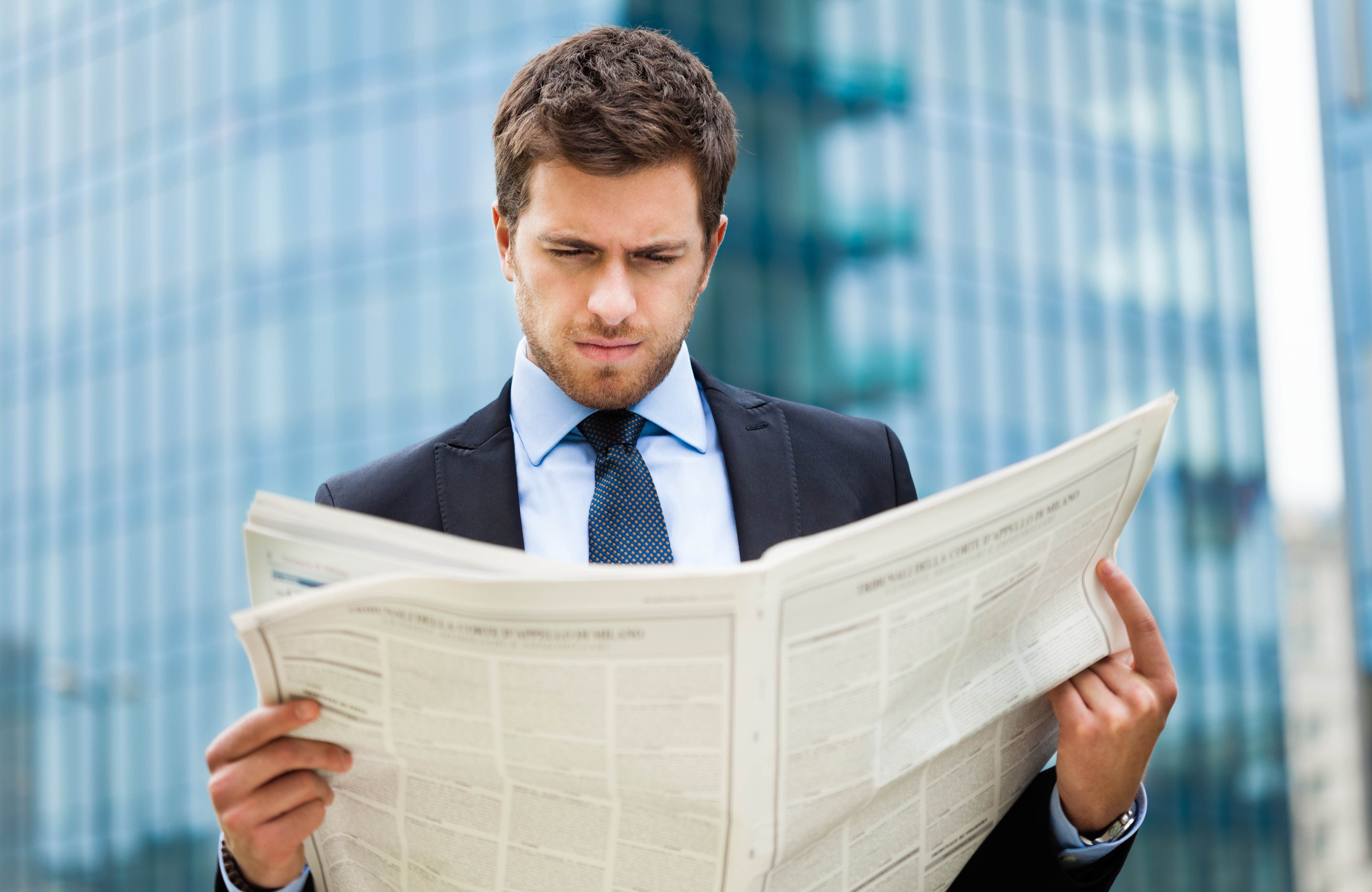 man reading a newspaper